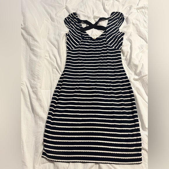 Guess mini dress with cross back detail and zipper in the front. Fair condition. - Picture 4 of 4